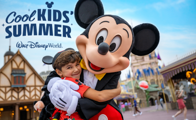 A child dressed in red hugs Mickey Mouse at Walt Disney World, with Cinderella’s Castle and other park buildings in the background. Text reads “Cool Kids' Summer” and “Walt Disney World.”.